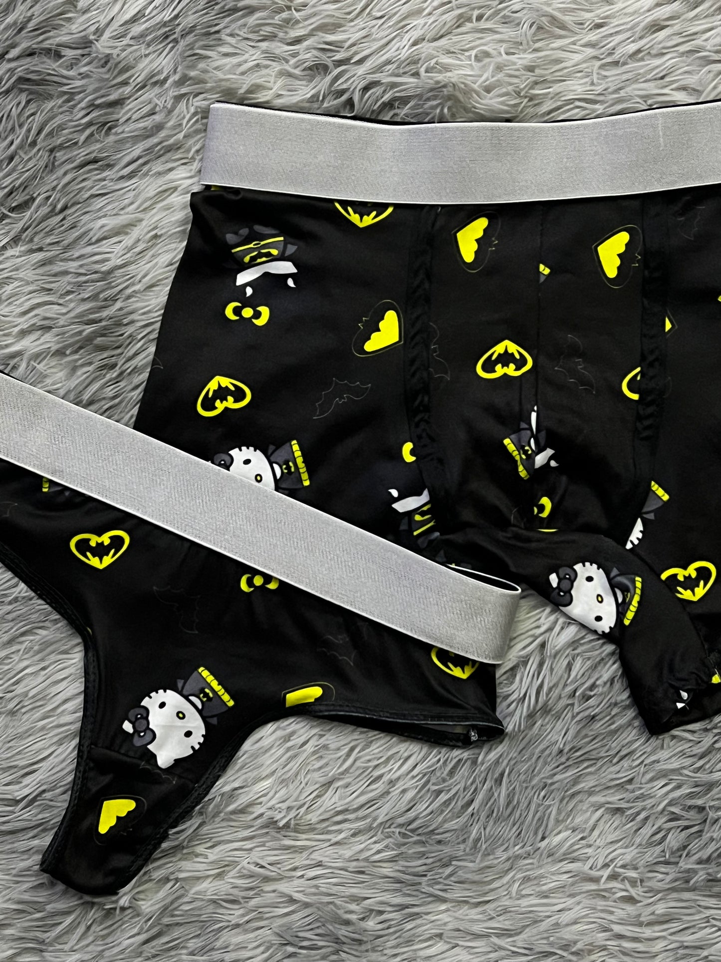 Hello Kitty dressed as Batman black background matching underwear