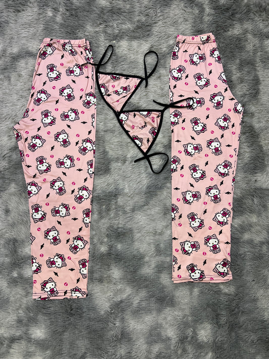 Kitty dressed as a pink background mummy Halloween Plush pajama duo