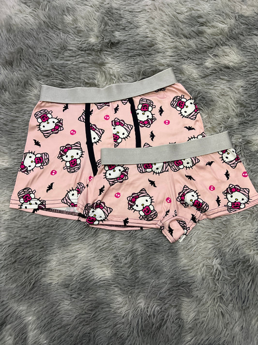 Kitty dressed as a pink background mummy matching couples boxer underwear Halloween