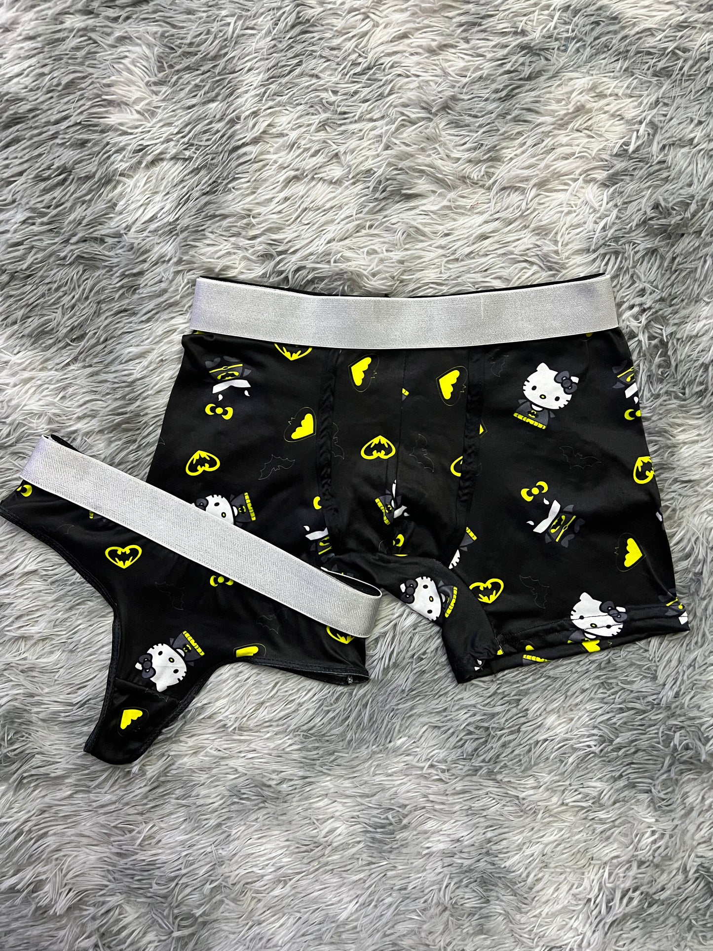 Hello Kitty dressed as Batman black background matching underwear