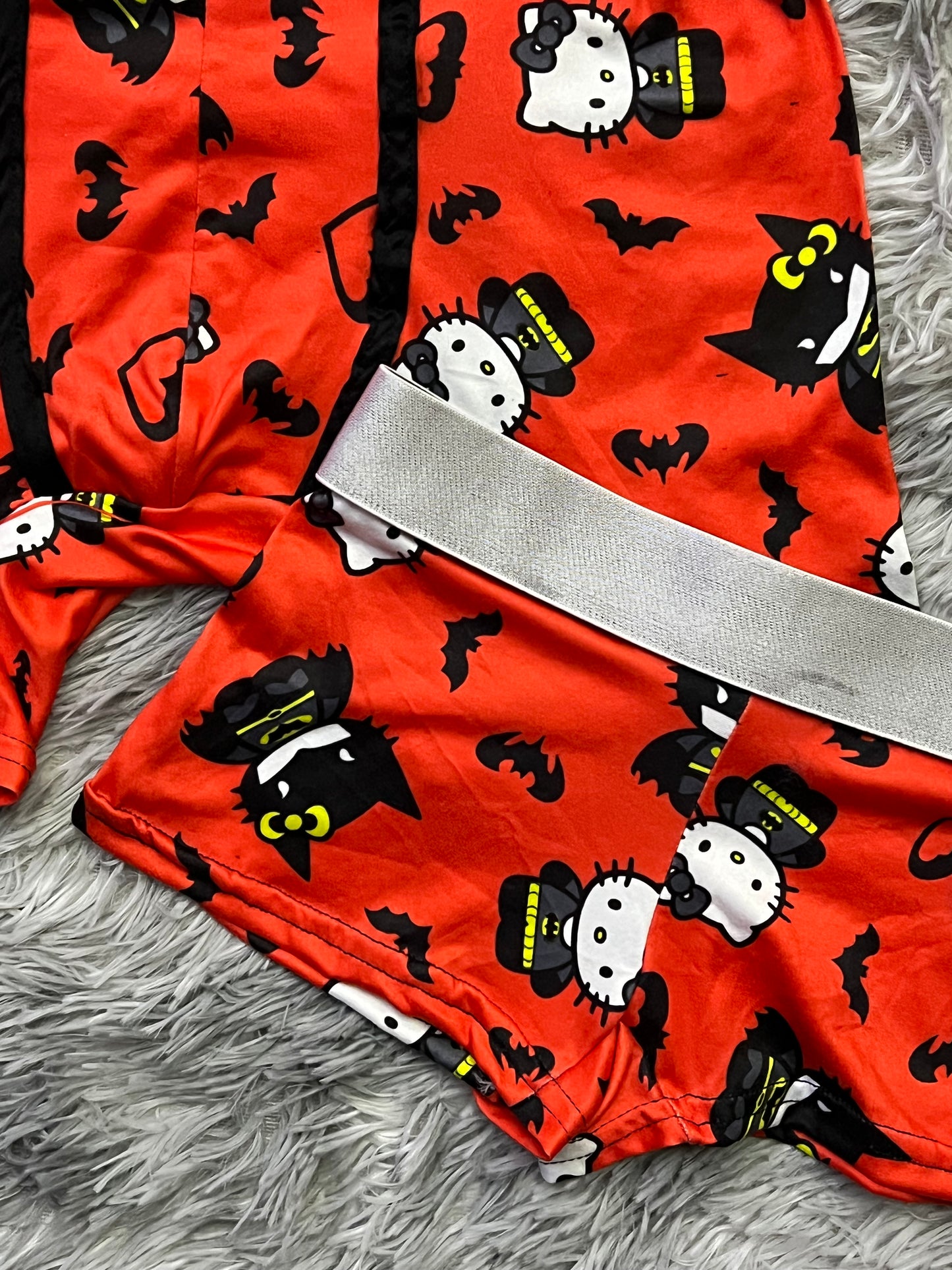 Hello Kitty dressed as Batman orange background matching boxer underwear