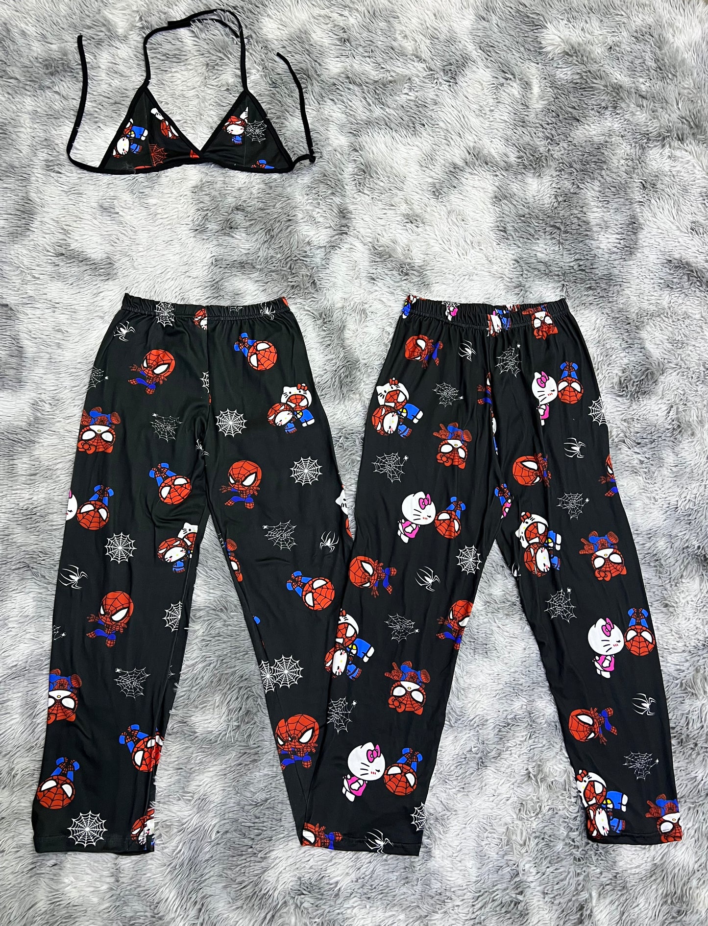 Hello kitty and Spiderman white spiderwebs black background pajama duo