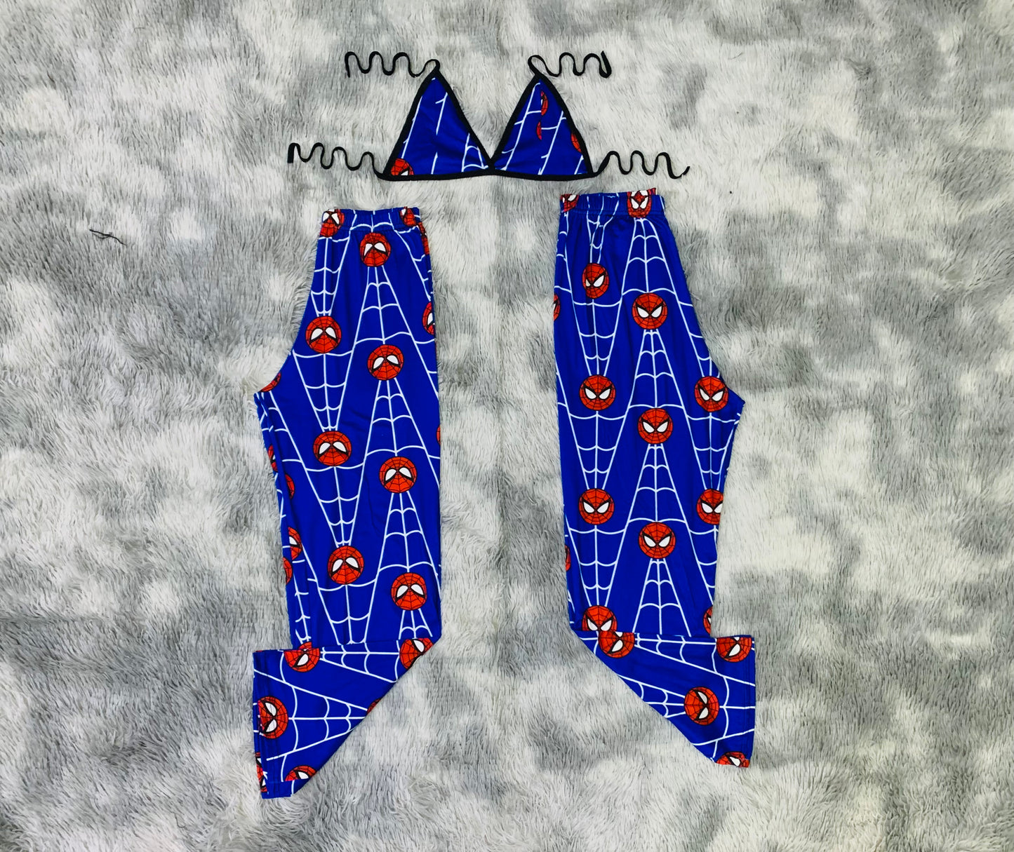 Spiderman with cobwebs on a blue background Plush pajama duo